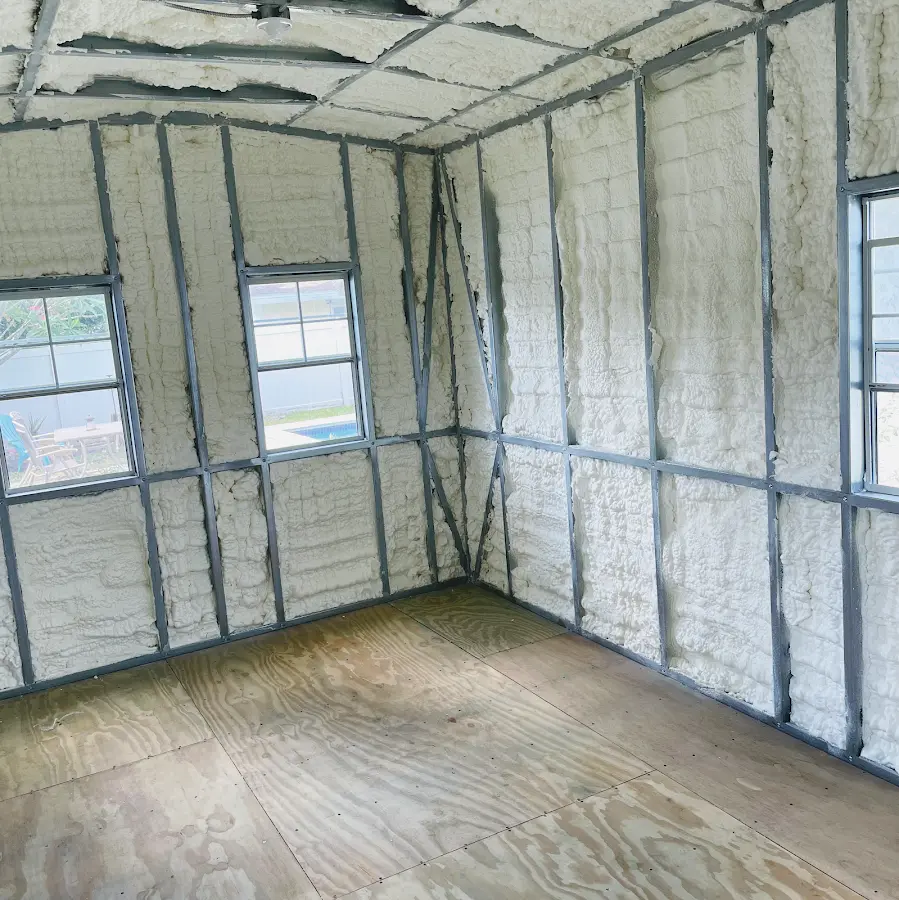 Closed-cell spray foam insulation applied to wall cavities in a residential project in Tucker